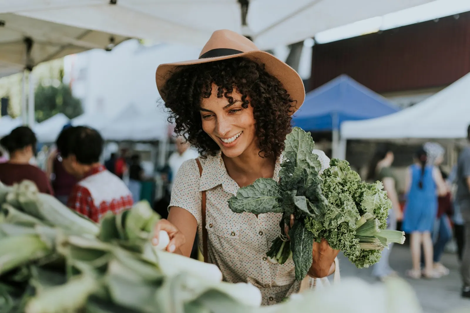 Visitors browsing fresh produce at a local farmers market